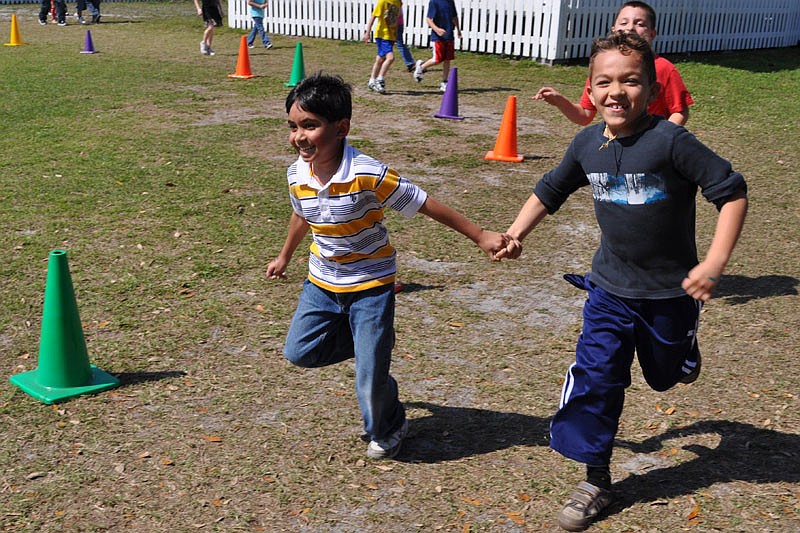 Friends Talha Haque and Julian Milian raced around the track in unison.