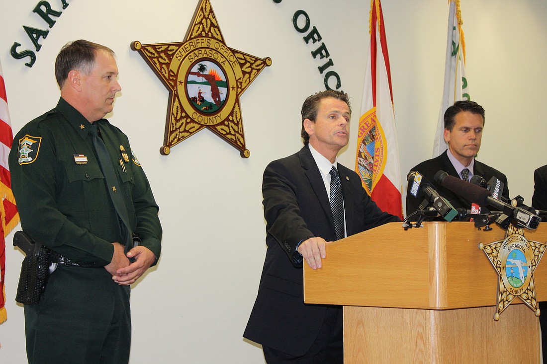 Sheriff Tom Knight, left, U.S. Attorney Robert O'Neill and FBI Special Agent Steven Ibison announced the 14 indictments.