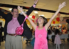 Allison Tibor, 9, showed her grandpa, Mel Neely, how to dance the "YMCA."