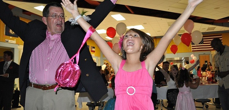 Allison Tibor, 9, showed her grandpa, Mel Neely, how to dance the "YMCA."
