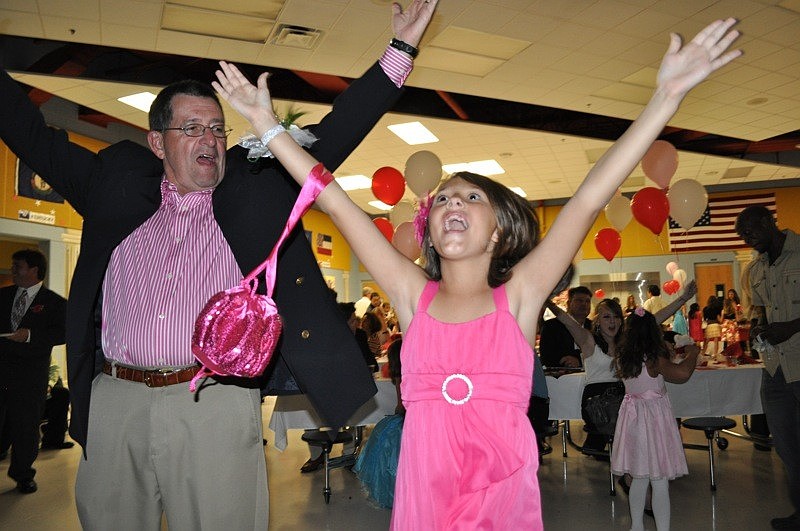 Allison Tibor, 9, showed her grandpa, Mel Neely, how to dance the 