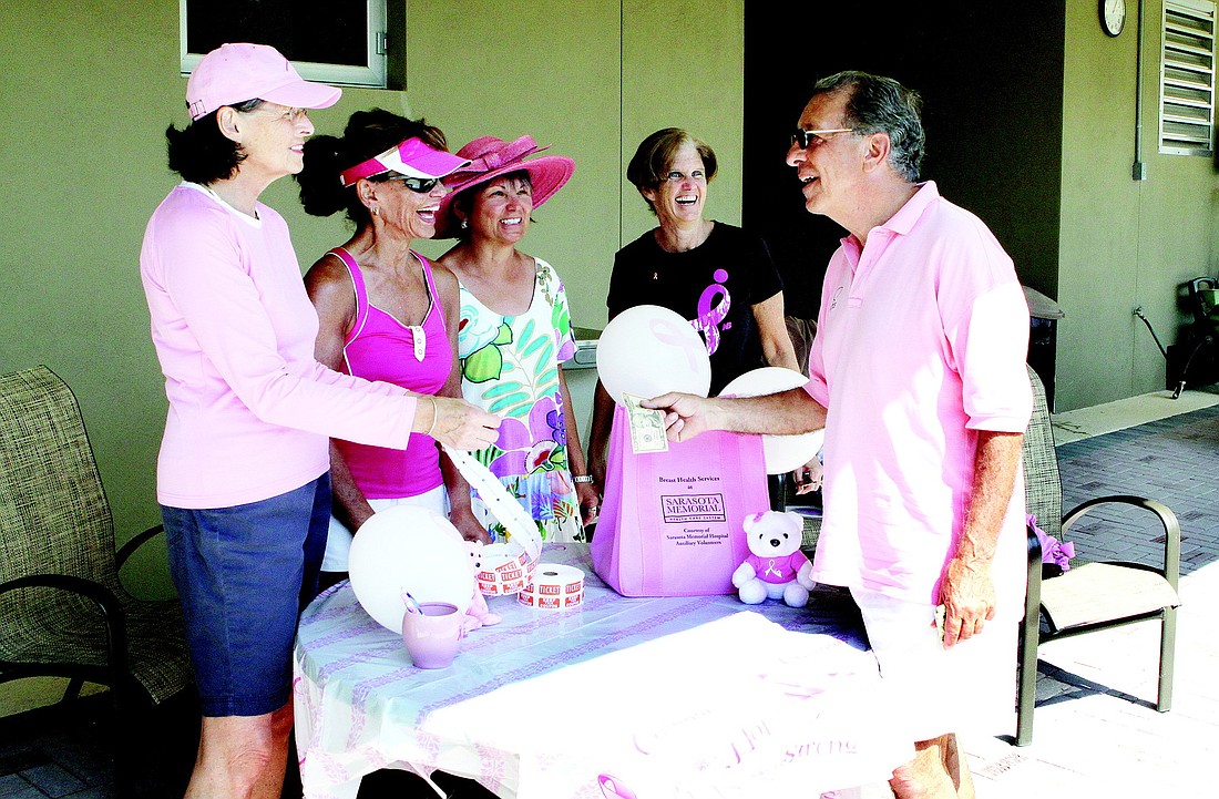 Eve Wickwire, Susan Singer, Patti Ostroski and Laurin Goldner were excited to sell their first raffle ticket to Larry Panza Feb. 24, at the Longboat Key Public Tennis Center.