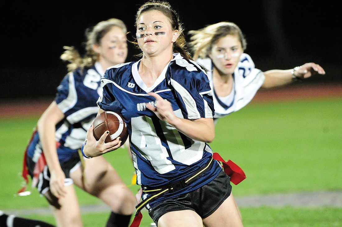 The Out-of-Door Academy sophomore Ashtin Frank rushes for a Team Blue first down during the school's first O Bowl under the stadium lights.