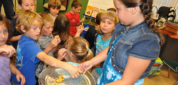 Jordan Cangro, 8, passed out chocolate chip cookies as part of the "Great Cookie Election."