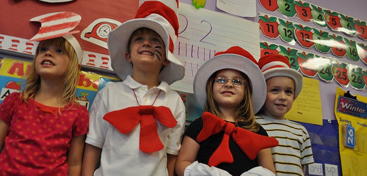 Paeten Feathers, Matt Schefer, Cayla Weinsberg and Curtis Reynolds all dressed as the Cat in the Hat.