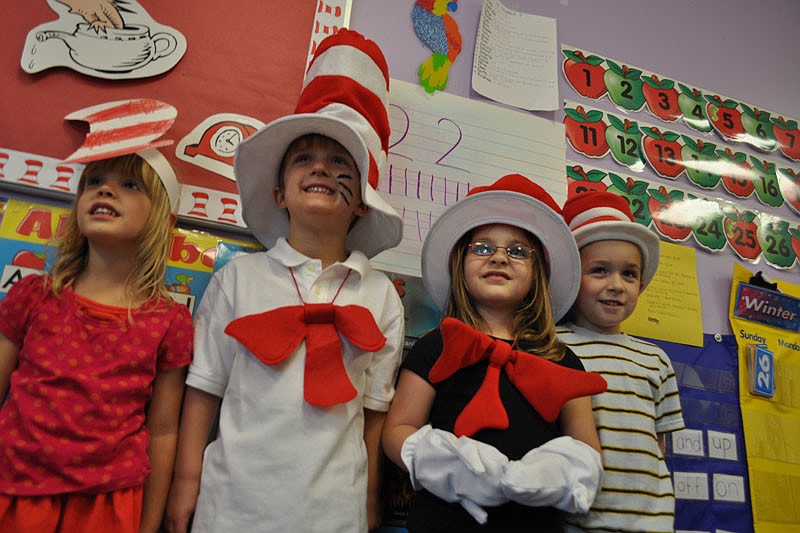 Paeten Feathers, Matt Schefer, Cayla Weinsberg and Curtis Reynolds all dressed as the Cat in the Hat.