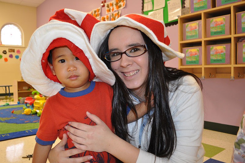 Even 2-year-old Kion Holly, with teacher Rachel Wilson, enjoyed the festivities.