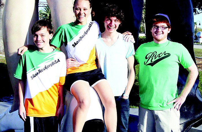 Cal Davidson-Turner, Kim Hyslop, Morgyn Stauffer and Garrett Lyons meet every Saturday morning at the Unconditional Surrender statue for their long run.