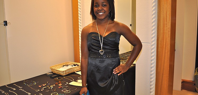 Jayna Antoine, 13, chose a black satin dress with a sweetheart neckline and sequin empire waistband. Hundreds of girls headed to Saks Fifth Avenue Monday and Tuesday in search of their perfect prom dress through the Cinderella Project.