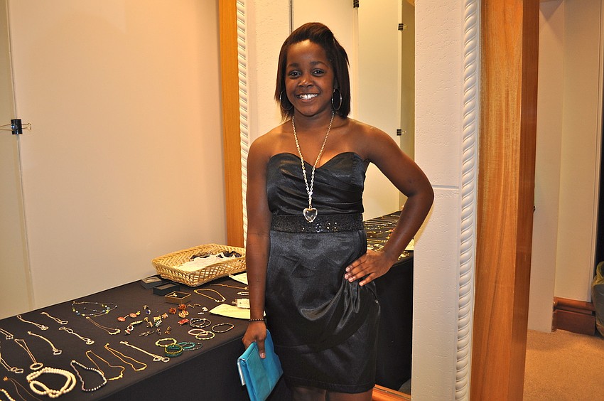 Jayna Antoine, 13, chose a black satin dress with a sweetheart neckline and sequin empire waistband. Hundreds of girls headed to Saks Fifth Avenue Monday and Tuesday in search of their perfect prom dress through the Cinderella Project.
