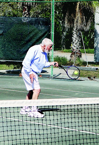 Dave Garelick plays tennis once a week at the Longboat Key Public Tennis Center and says he feels "uplifted" by his lessons.
