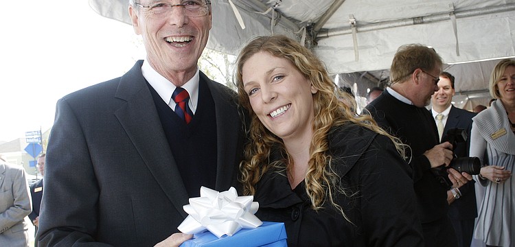 LECOM student Lauren Acton, right, was the guest of honor at Pat Neal's 8,000th home sale celebration March 11.