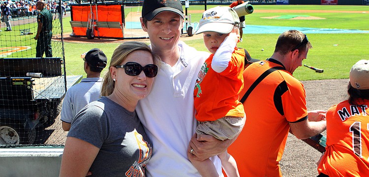 Meredith, Eric and Will Piazza hang out by the Orioles dugout before the game.
