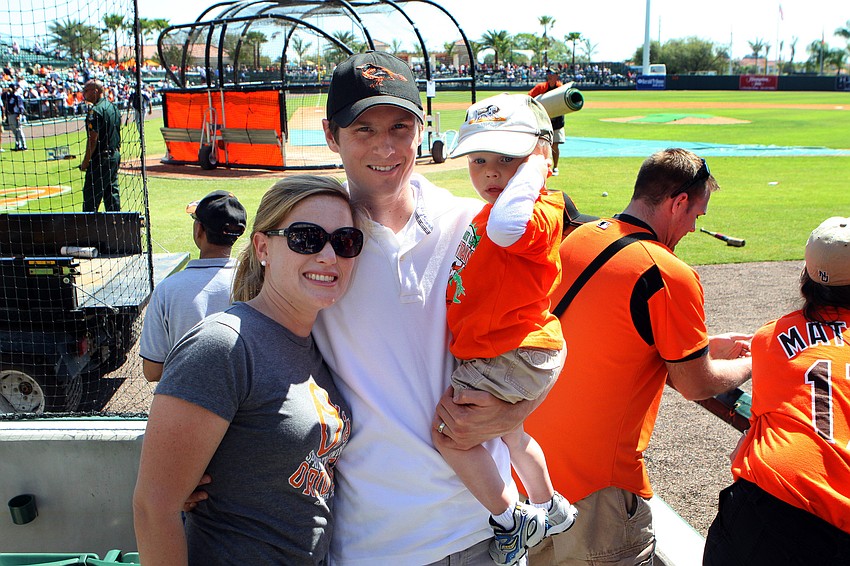 Meredith, Eric and Will Piazza hang out by the Orioles dugout before the game.