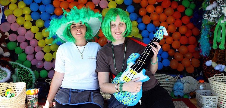 Karolyn Marku and Cat McGrath work the game area on Saturday, March 12 at the Sham Rock Festival on Hillview.