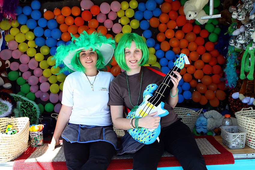 Karolyn Marku and Cat McGrath work the game area on Saturday, March 12 at the Sham Rock Festival on Hillview.
