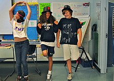 Ally Cohen, Makenzie Brown and Drew Fenner performed a skit and rap before their classmates.