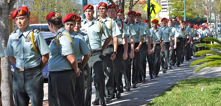 About 700 Sarasota Military Academy students marched from their school campus to First Baptist Church to attend the funeral of Sean Leonard and his sister, Jessica.
