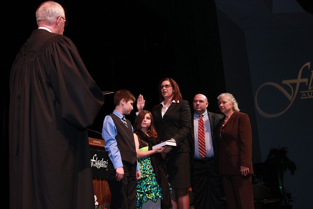 Judge William Parsons swore in Melissa Moore Stens, 14 years after he swore her in as an attorney.