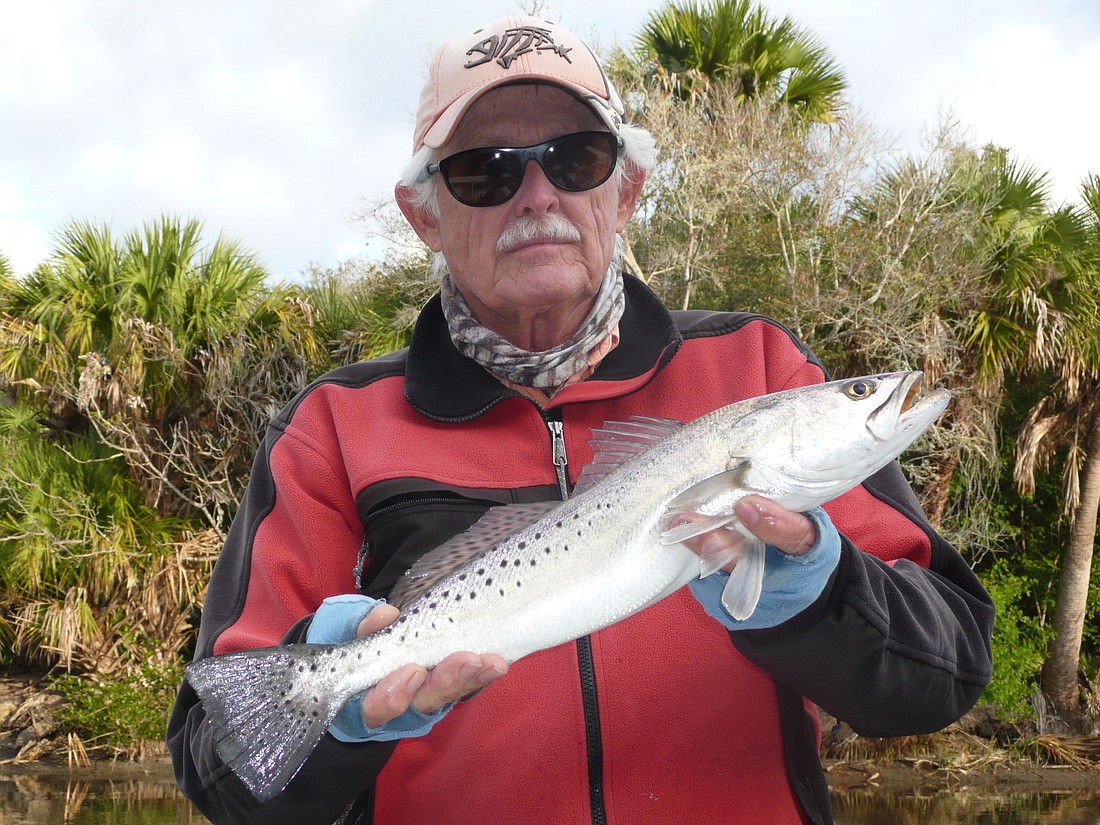 Capt. Kent Gibbens with a speckled sea trout he caught on a white fly. PHOTO BY CAPT. ROB OTTLEIN