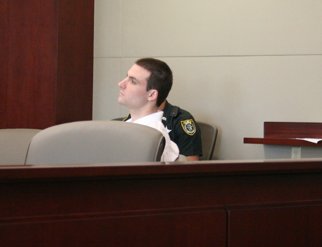 Michael Cona waits to hear the jury's verdict. Photo by Megan Hoye.