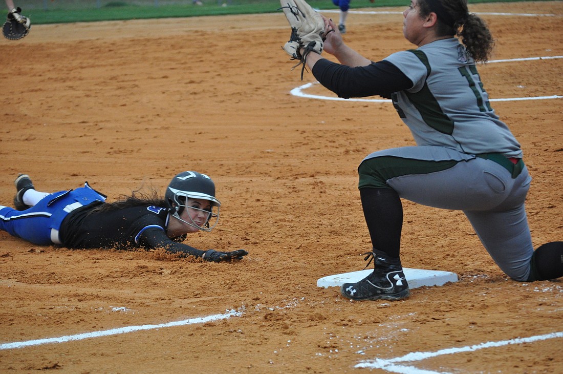 Matanzas' Kelsey Lukes dives into third base. PHOTO BY ANDREW O'BRIEN