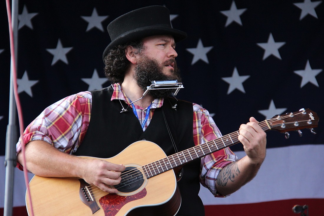 Tony Cuchetti, of The AfterWhile, plays at the 2012 Rock 'N' Rib Fest. This year they will compete in the Texaco Country Showdown. FILE PHOTO BY SHANNA FORTIER