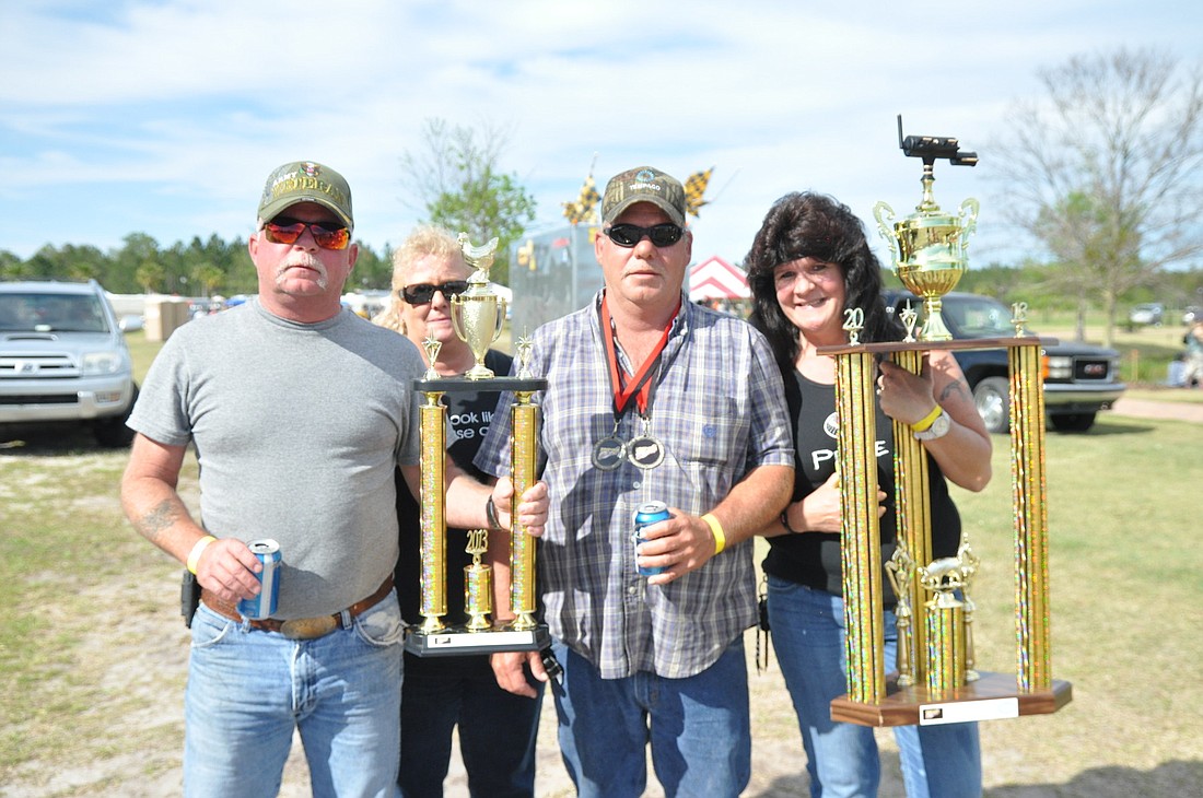 Rick Simmons, Joanna Simmons, Donnie Nobles and Mary Husch, of Donnie's BBQ, were Grand Champions of the Backyard BBQ Contest.