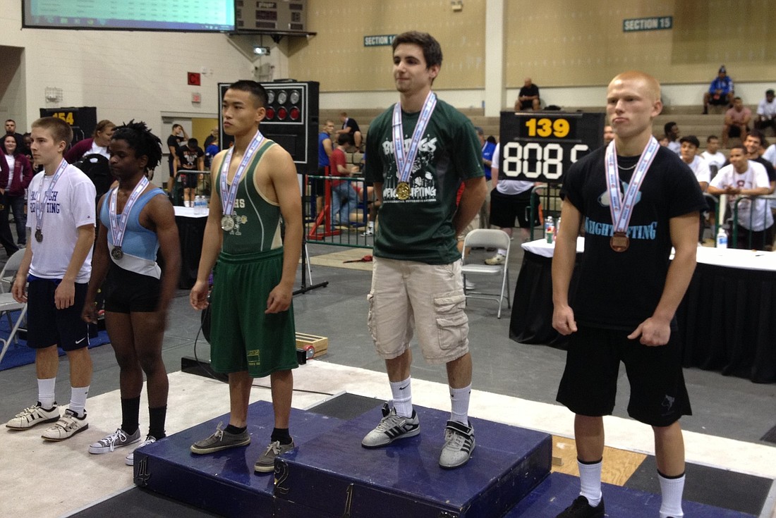 FPC's Devon McIntire (second from the left) won the Class 2A state weightlifting title in the 119-pound class. COURTESY PHOTO