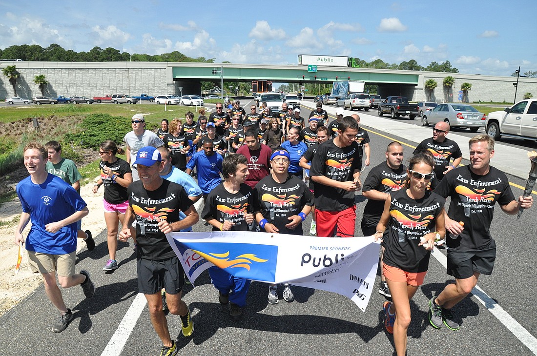 Special Olympics athletes joined officers and Flagler County Runners for the Flagler County Special Olympics Florida Law Enforcement Torch Run.