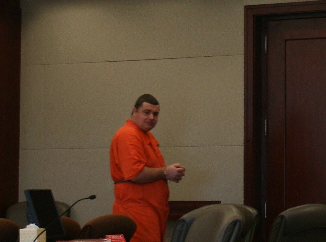 Aaron Kinney waved goodbye to his mother with bound hands after his sentencing hearing Monday.