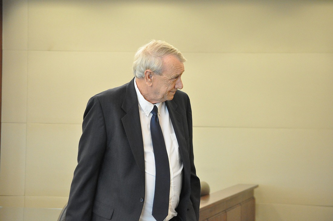 Paul Miller leaves the courtroom during his trial Monday. Photo by Shanna Fortier.