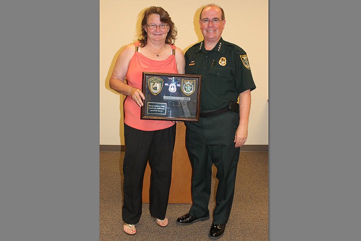 Deputy Cathy Weeks and Sheriff Jim Manfre. Weeks retired last week after 26 years. COURTESY PHOTO