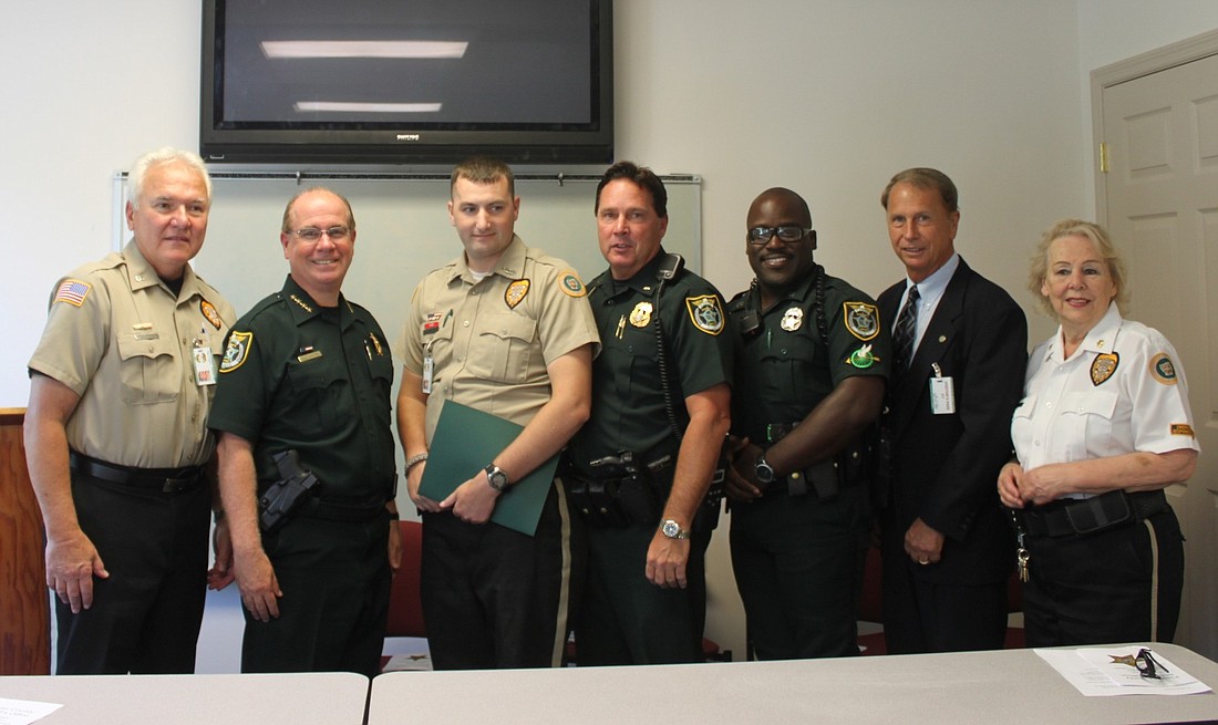 From left: Peter Petropulous, Sheriff Jim Manfre, Robert Humphries, Precinct Cmdr. Mark Carman, Deputy Otis Gilyard, Randall Stapleford and Sonia Byrne. COURTESY PHOTO