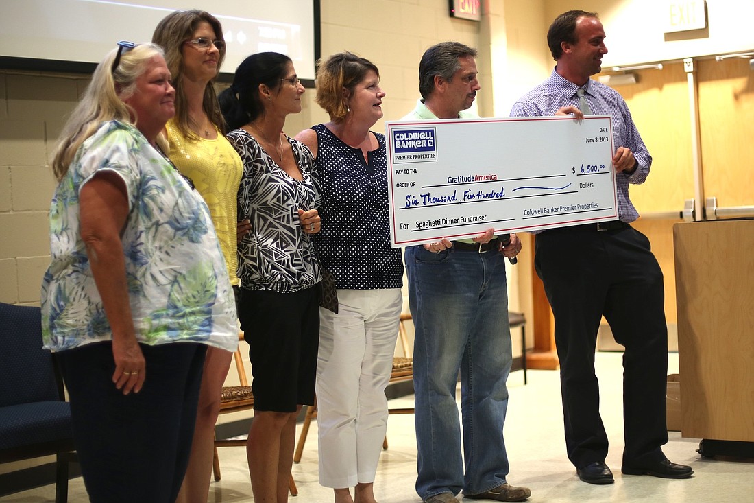 On June 16, a $6,500 check was presented to GratitudeAmerica from Tom Heiser, of Coldwell Banker Premier Properties.