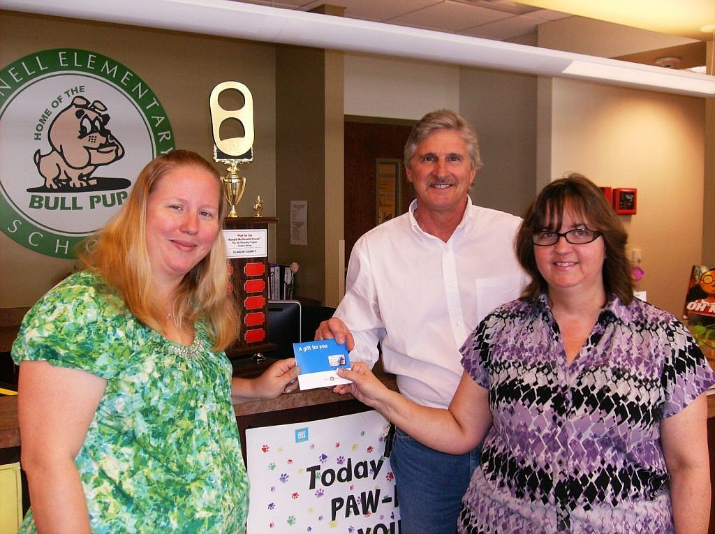 Amy Canna, Bunnell Elementary PTO president, Richard Dupont, Bunnell Elementary principal, and  Cindy Lott, of McDonalds, Pisces 2 Inc., local store marketing COURTESY PHOTO