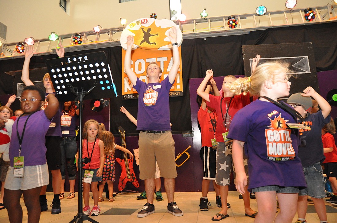 Joshua Ore, center, leads youth in opening worship time. PHOTOS BY SHANNA FORTIER
