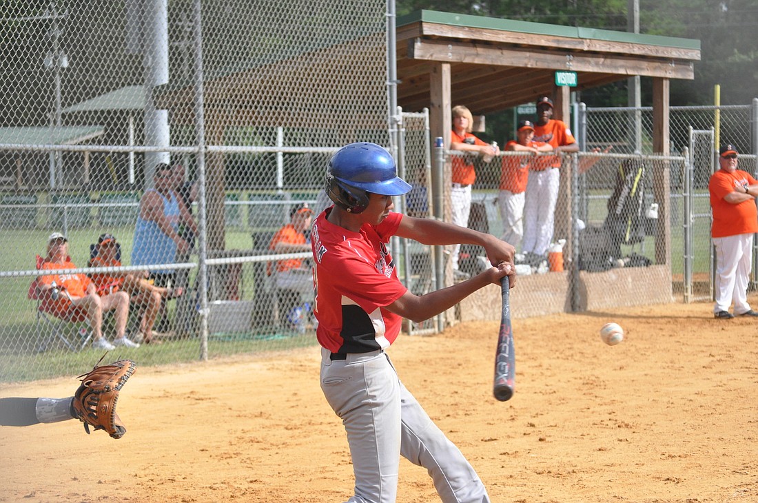 Anthony Seastram rips an RBI single during Saturday's elimination game of the District 13 PAL championships. PHOTOS BY ANDREW O'BRIEN