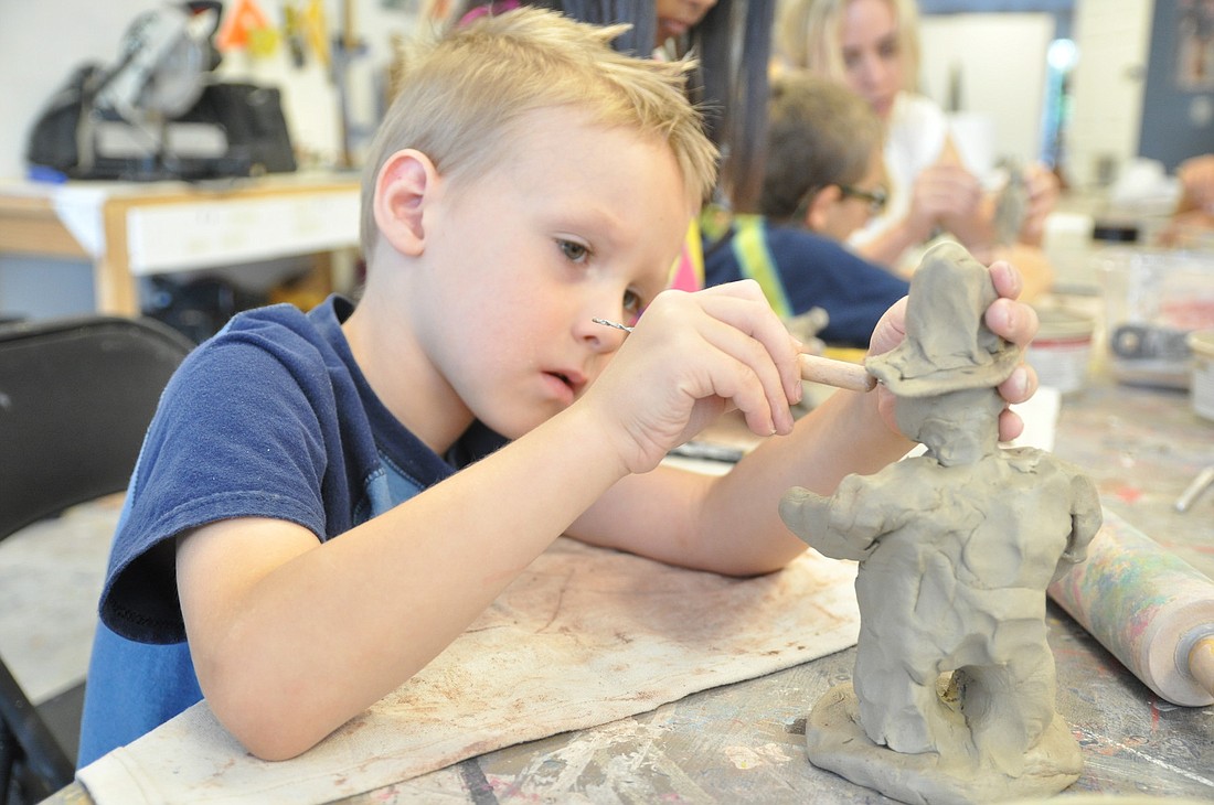 Gabe Graham works on his sculpture at the Hollingsworth Gallery Summer art Camp. PHOTOS BY SHANNA FORTIER