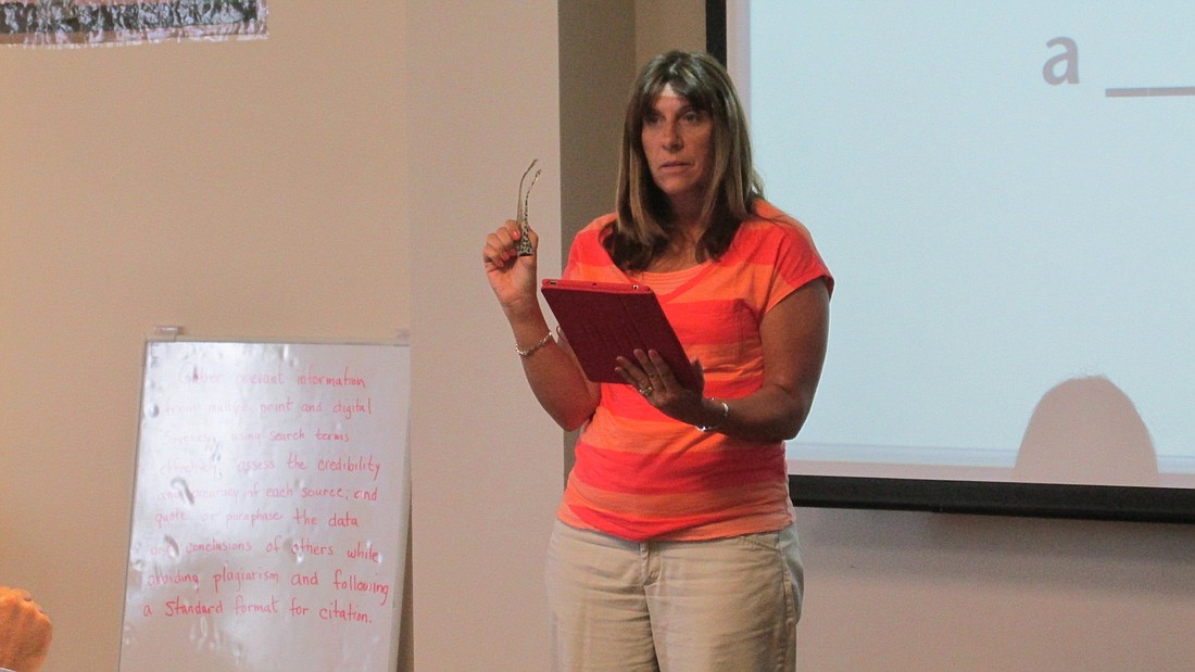Technology Coordinator Maria McGovern leads an interactive activity about technology in the classroom during Wednesday's strategic planning meeting. Photo by Megan Hoye.