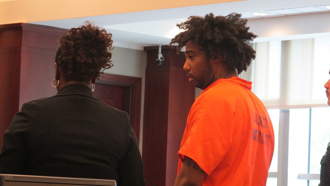 Jacquez Roland shakes his head as he hears his sentence. Photo by Megan Hoye.