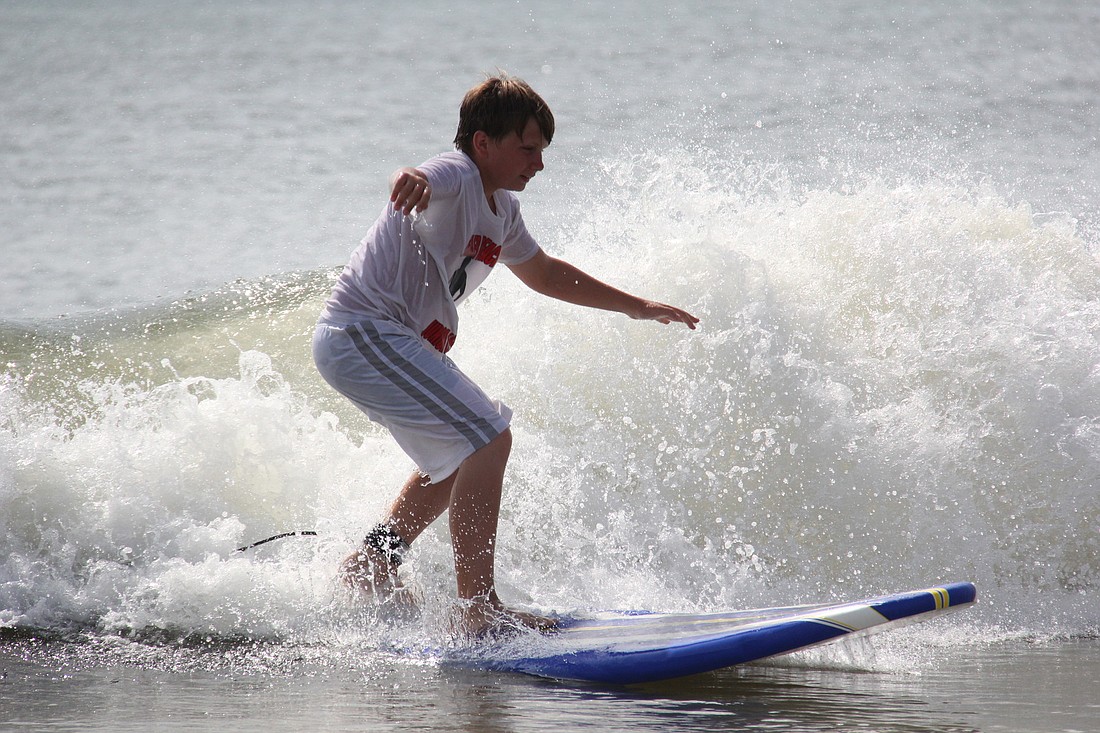 Brian McDonald catches a wave at Surf and Kayak Camp. PHOTOS BY SHANNA FORTIER