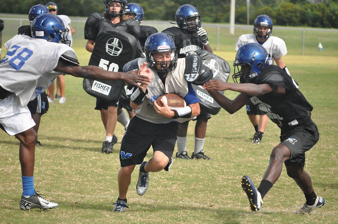 Matanzas running back Stefan Tucker carries the ball Thursday during practice. PHOTOS BY ANDREW O'BRIEN