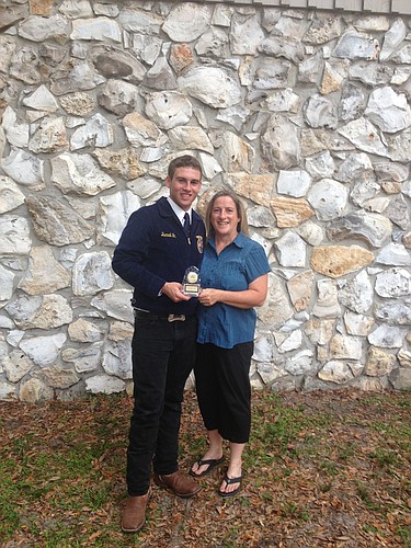 Austin Davis earned the Top Camper Returning Camper for the second year. The award is based on practical and written application of skills learned. He is pictured with FFA Advisor Johanna Davis. COURTESY PHOTO