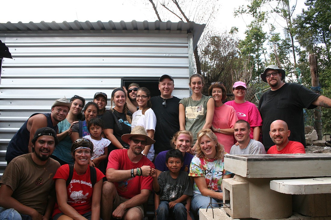 The team after completing the first house build. COURTESY PHOTO
