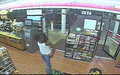 This person of interest was seen purchasing a hat similar to the one worn in the August 2013 robbery at a nearby gas station just before the robbery occurred.