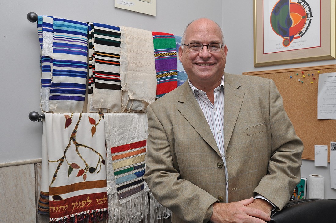 Cantor Zev Sonnenstein collects prayer shawls. "I feel that when one wraps themselves, they can feel the presence of God and the holiness that we each have within us," he said. PHOTO BY SHANNA FORTIER