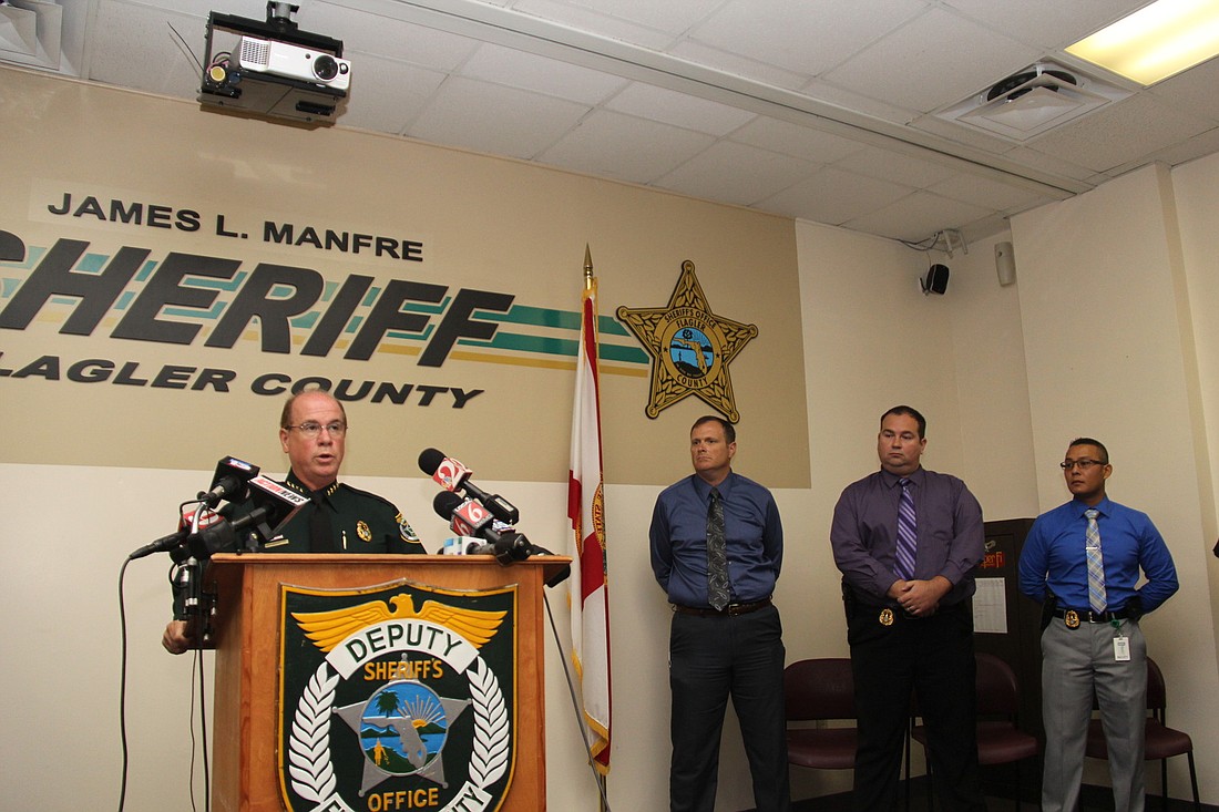 Flagler County Sheriff Jim Manfre addresses the media with investigators Steven Cole, Nate Koep and Mark Moy PHOTO BY SHANNA FORTIER