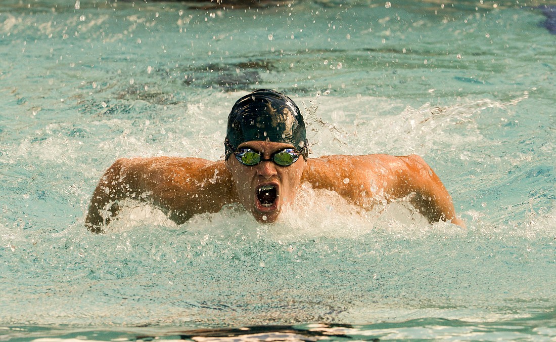 Josh Dixon in the 100-meter fly. He finished in 1:03.51. PHOTOS BY BOB ROLLINS