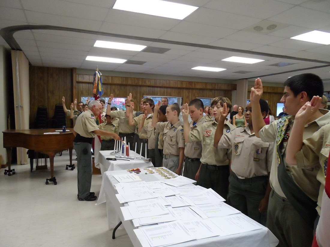 Boy Scout Troop 281 recite the Scout Oath and Scout Law. COURTESY PHOTOS